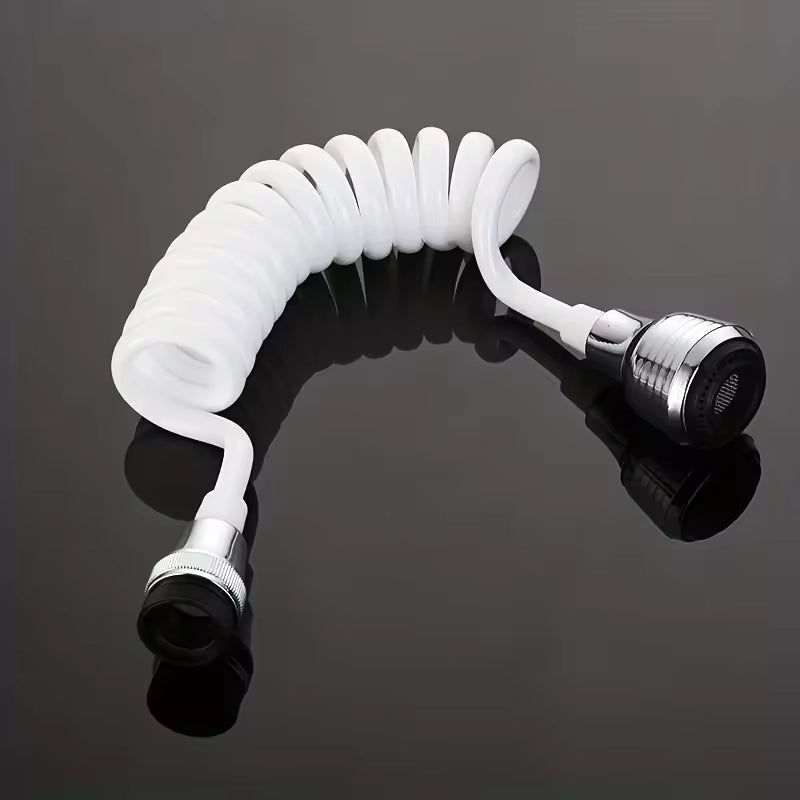 White coiled hose with silver fitting on a black reflective surface