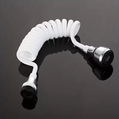 White coiled hose with silver fitting on a black reflective surface